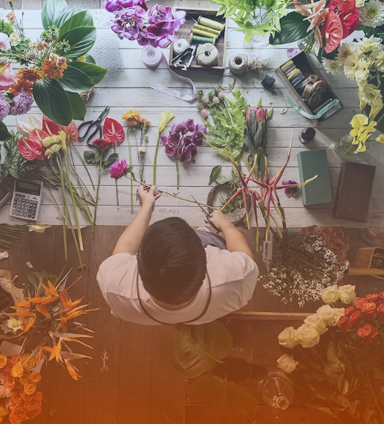 The picture of a man arranging fresh flowers